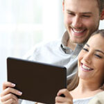 video ad 2 man and woman watching a tablet
