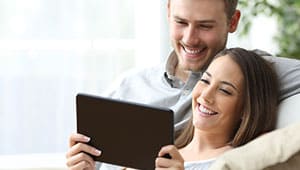 video ad 2 man and woman watching a tablet